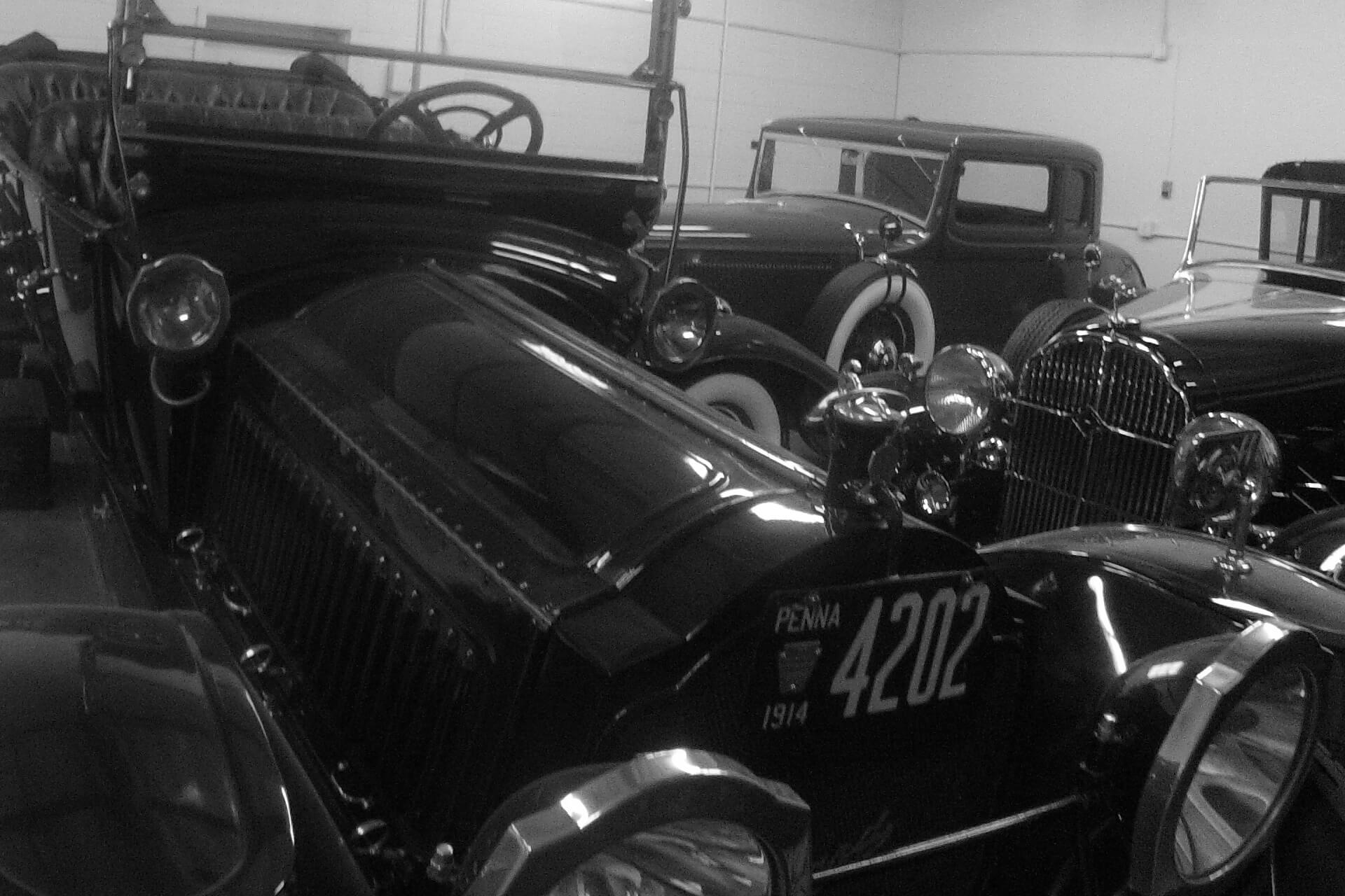 Prewar automobiles grouped inside the shop