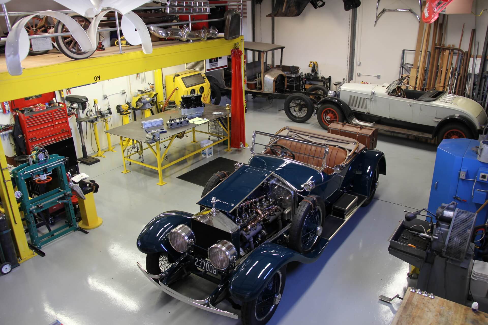 Blue prewar collector automobile inside the Pumphrey and Co. workshop