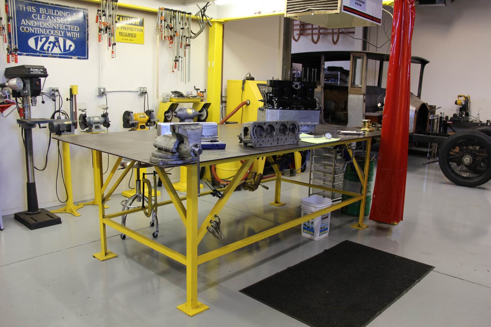 Workbenches and mechanical parts inside the Pumphrey and Co. shop